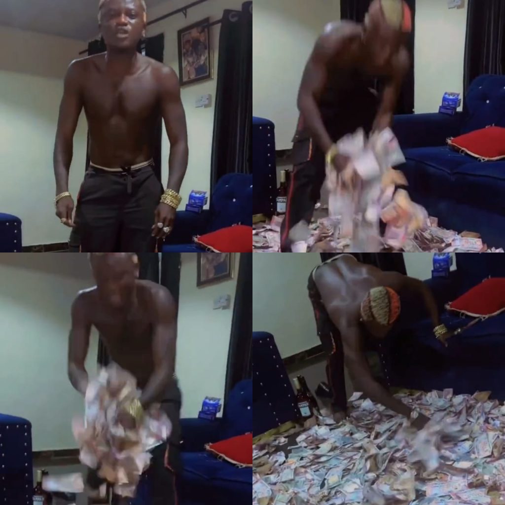 Singer Portable shows off wads of Naira notes his fans sprayed on him during a show (video)